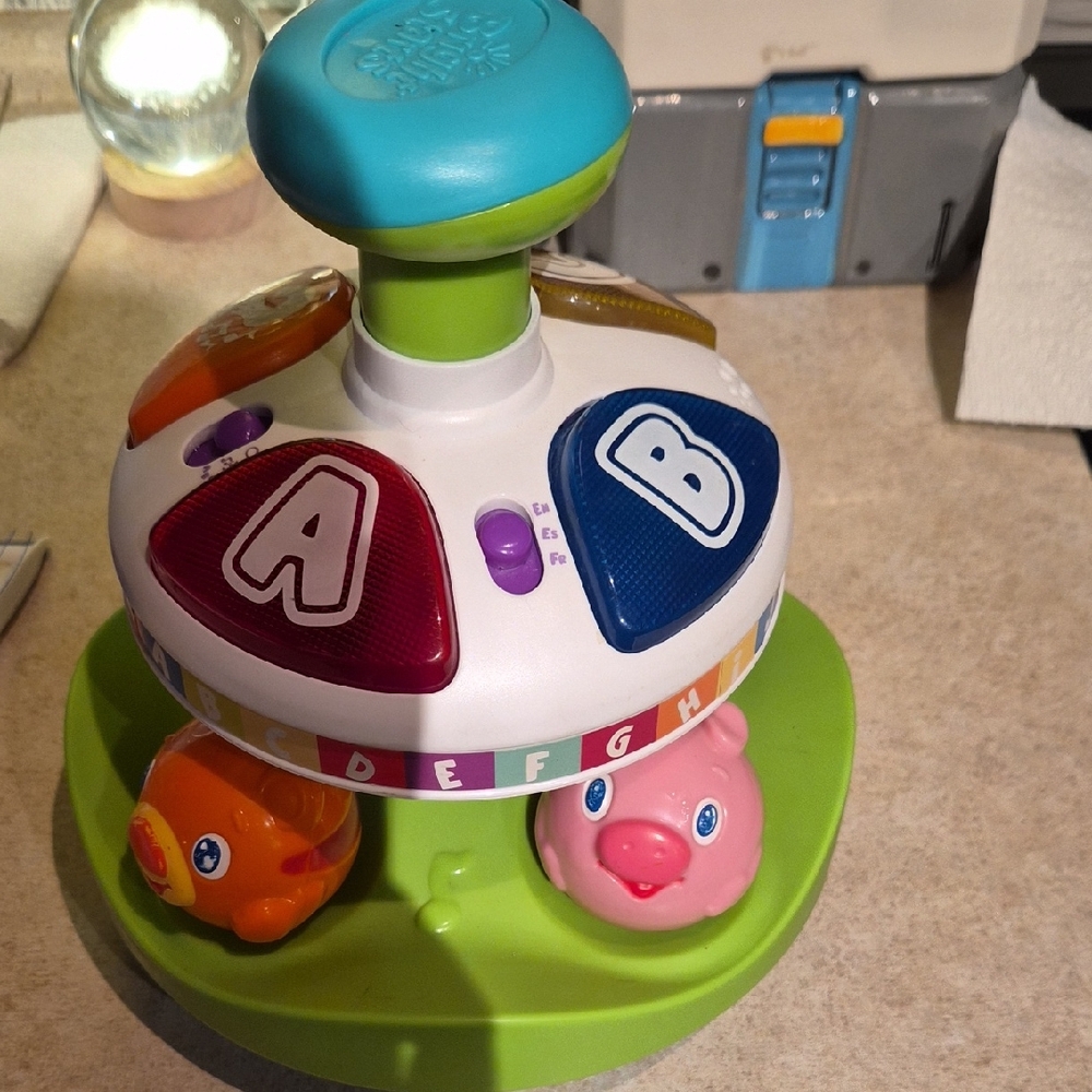 Interactive Spinning Toy with Lights and Sounds